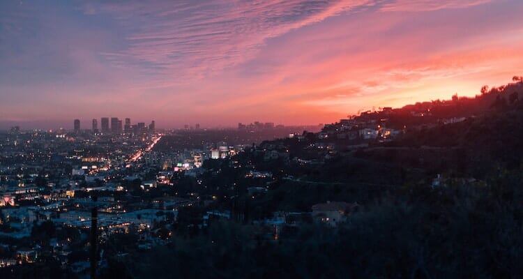 View of Downtown Los Angeles in California from mountains during sunset.